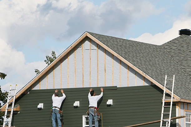 Professional Siding Installation technician working in Greenville, FL